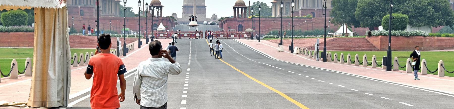 People walk on the path leading to the President's estate, New Delhi, India.