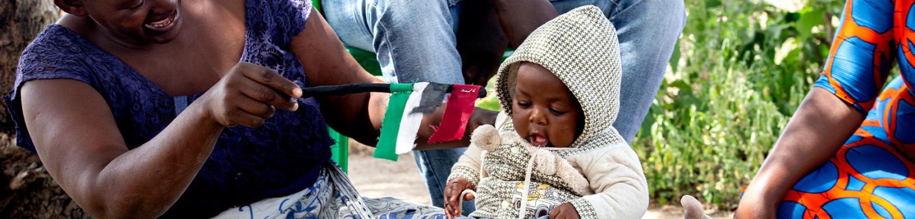 Photo of mother playing with infant in Tanzania