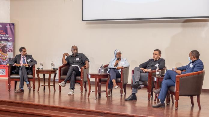 Photo of panel at an OPM hosted event in Kenya. Panellists from left to right: Michael Adenew, Country Lead, OPM Ethiopia Jeffrey Maganya - Head of Programmes, Oxfam in Africa, Panel Moderator - Fatima Osman, Deputy TL, HHMEL Programme, Naseer Khan - Social Protection Specialist, World Bank, David Kinyua - Humanitarian, Resilience and Inclusion Lead, FCDO